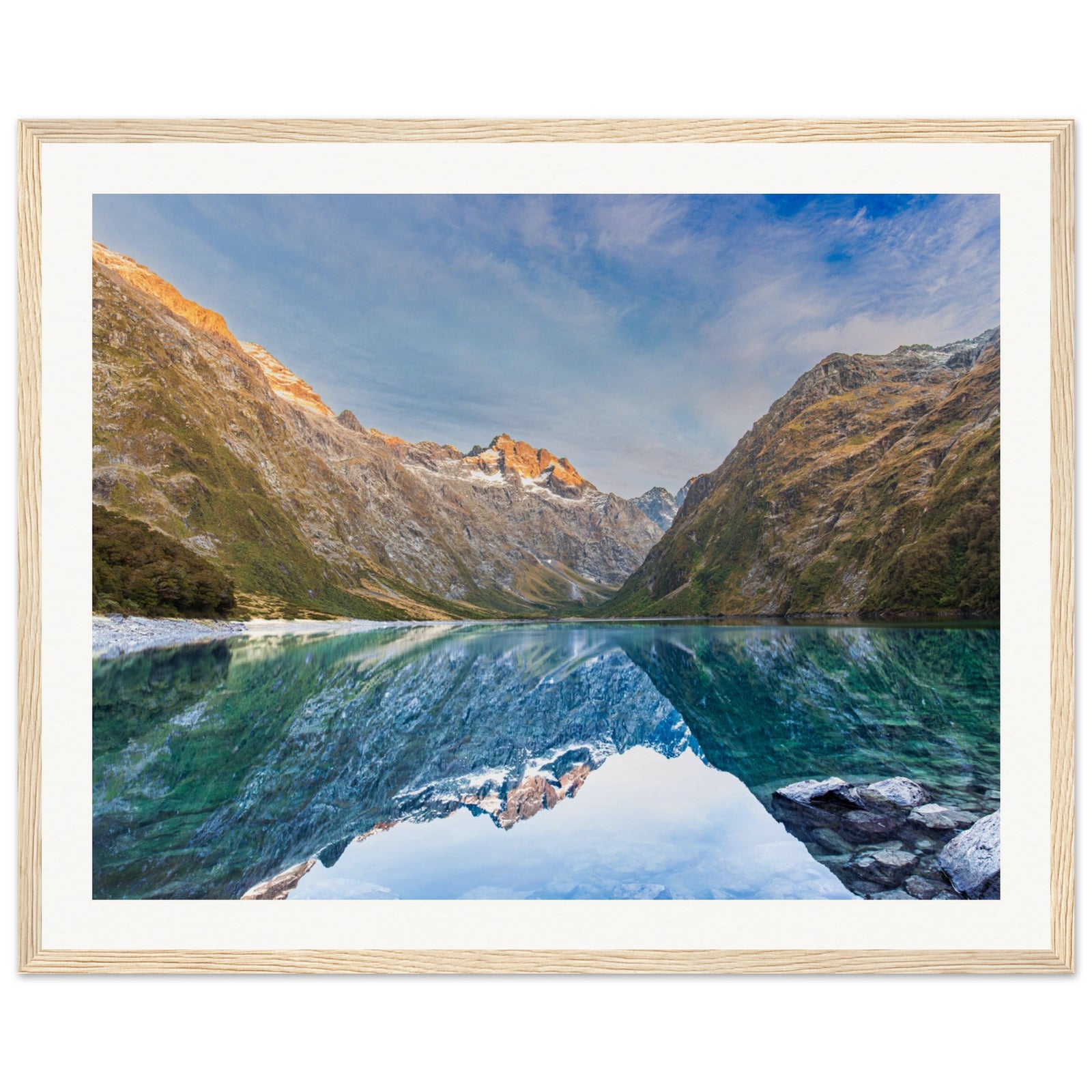 Portrait landscape with tranquil water and mountain pinpoint.