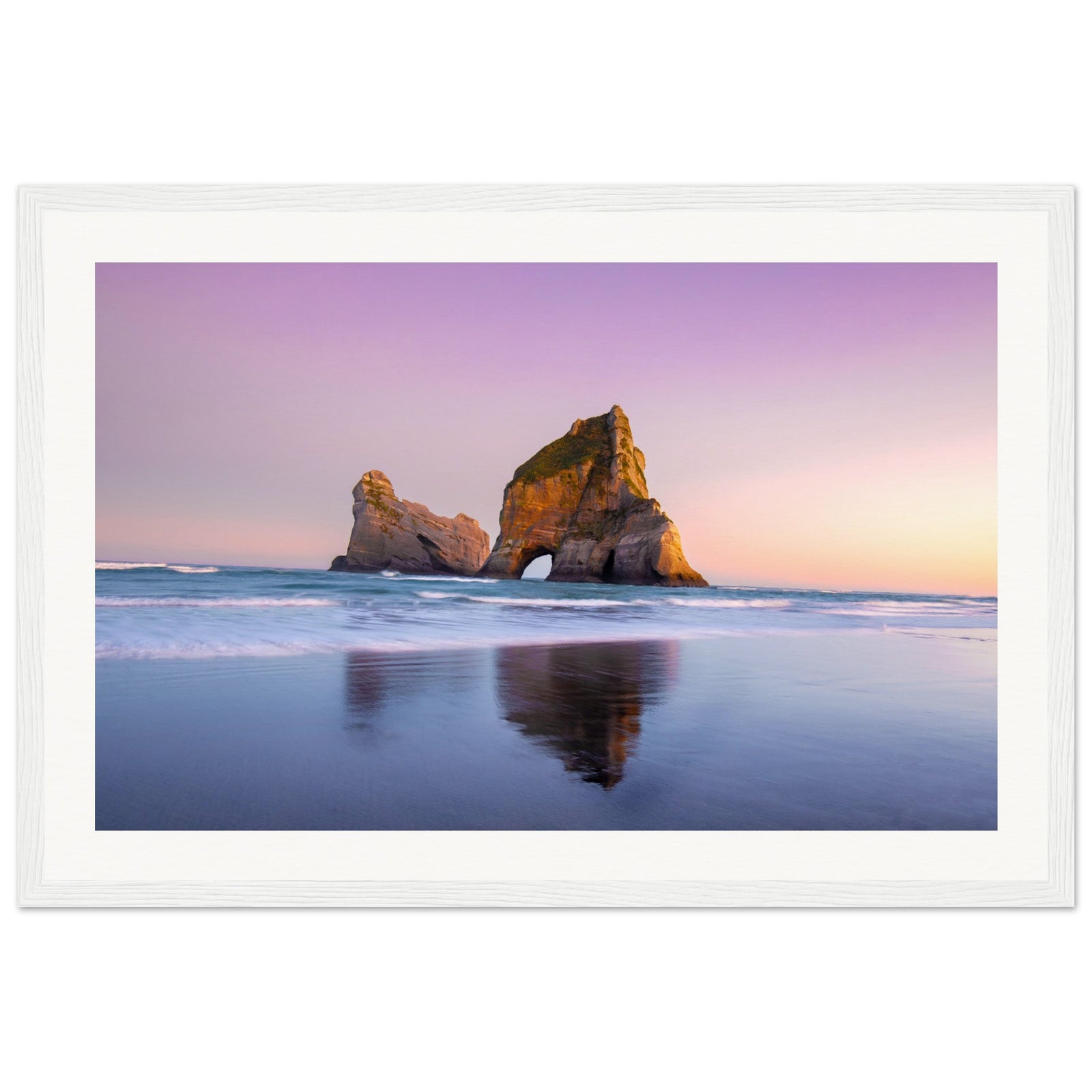 Serene ocean scene with pink sunset and rock silhouette.