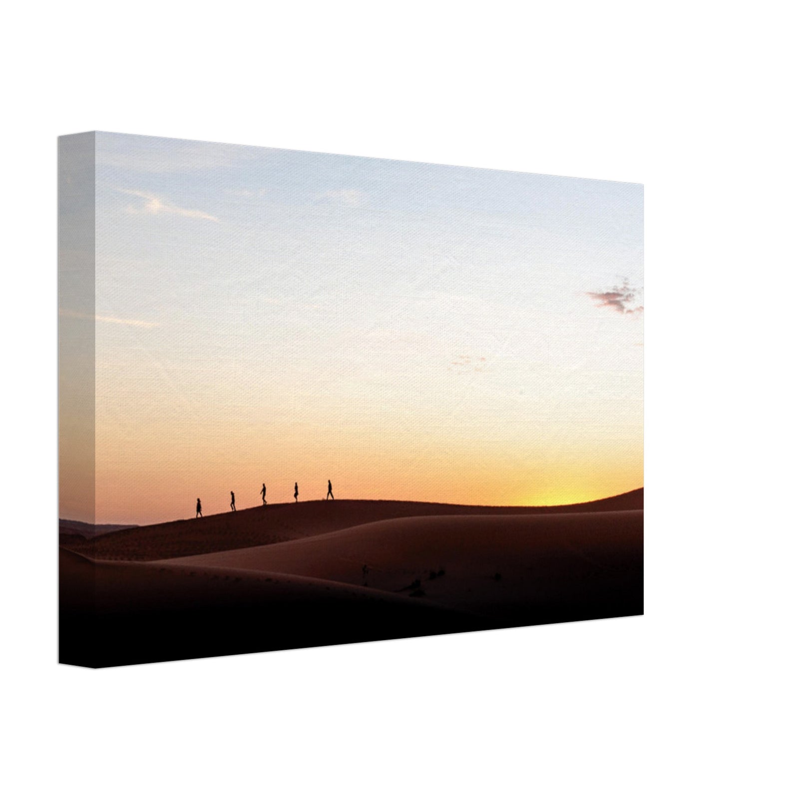 People trekking over sand dunes under a golden sky.
