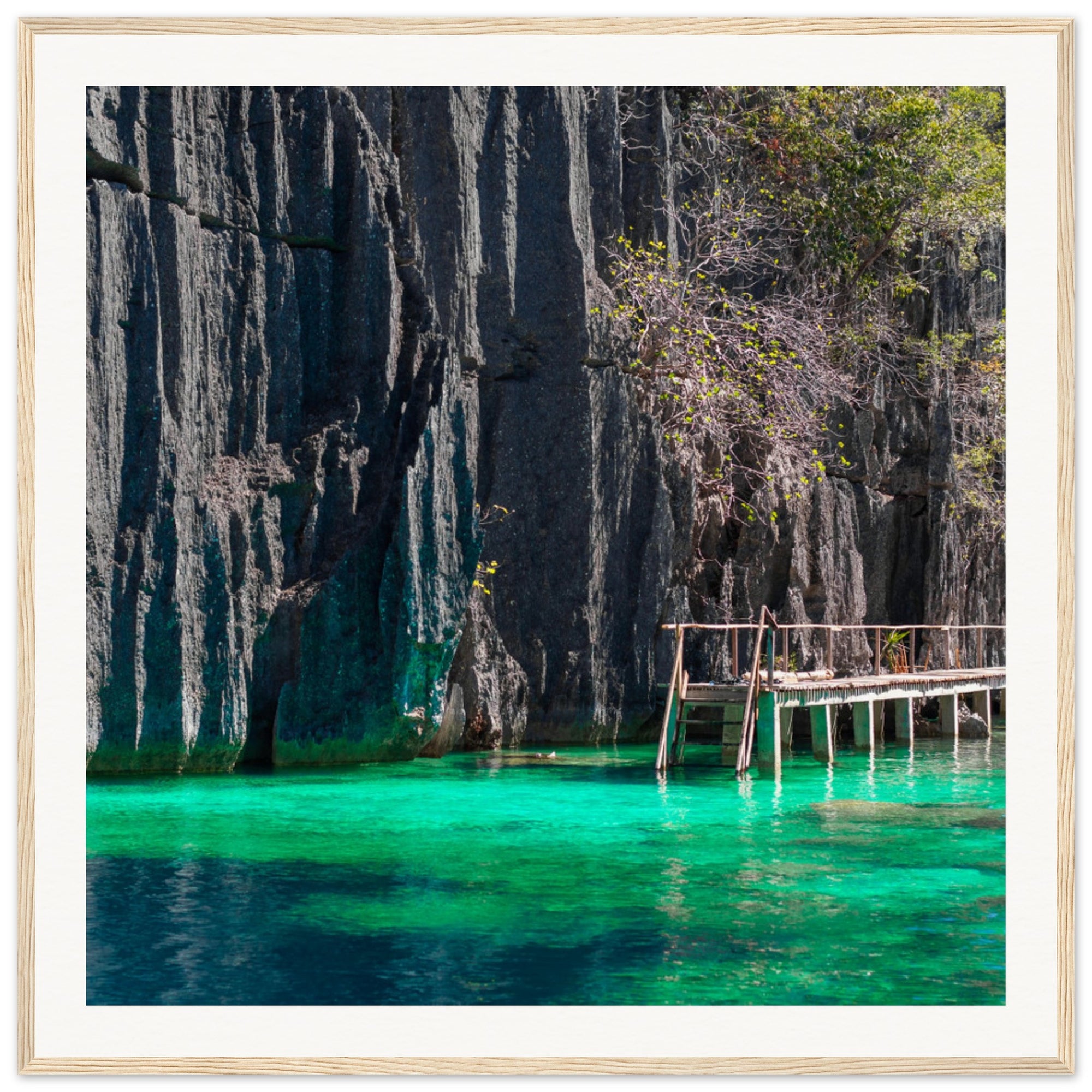 Nature wall art of steep rocky cliffs and a quiet lagoon walkway.

