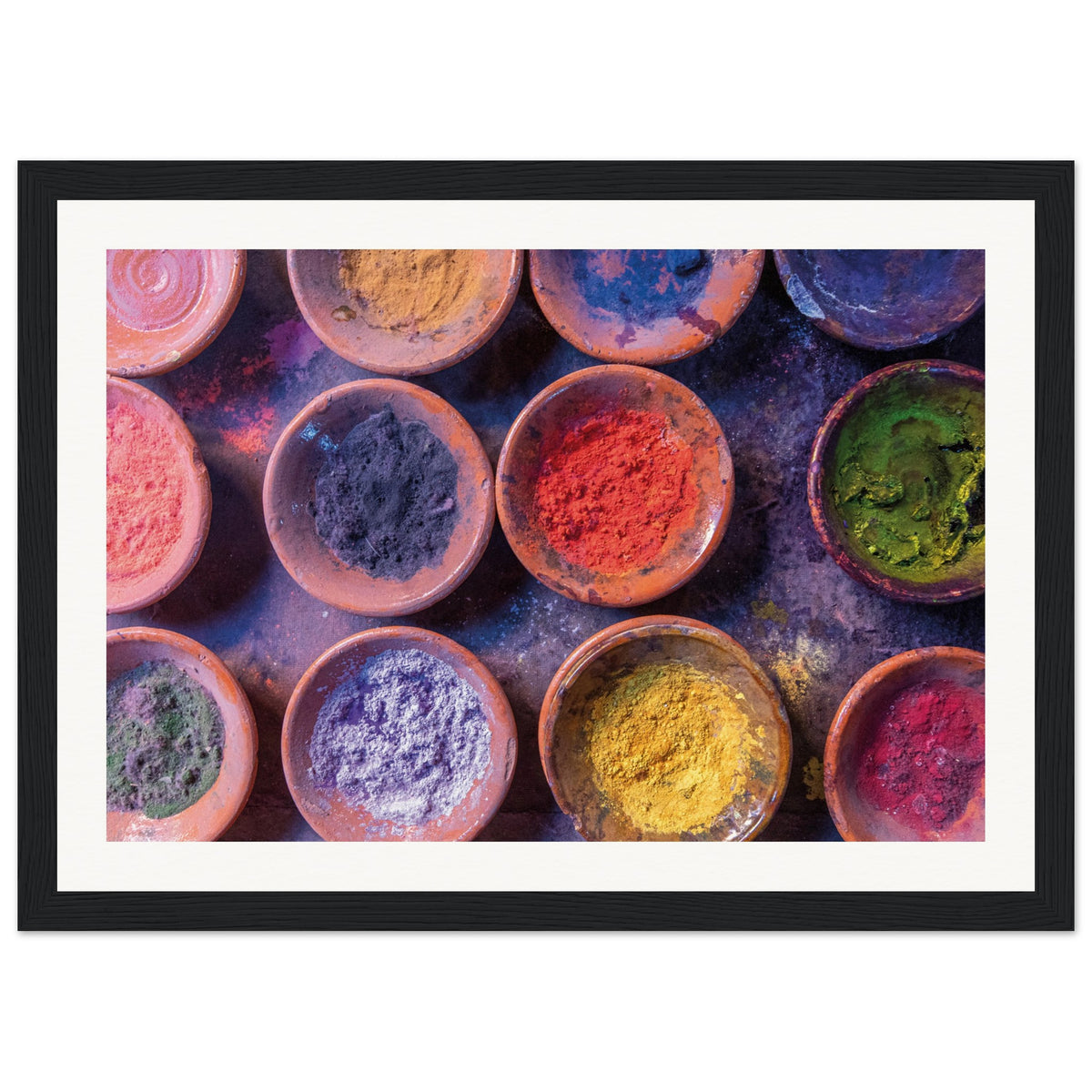 Wall print featuring assorted powdered colors for art or ceremony.

