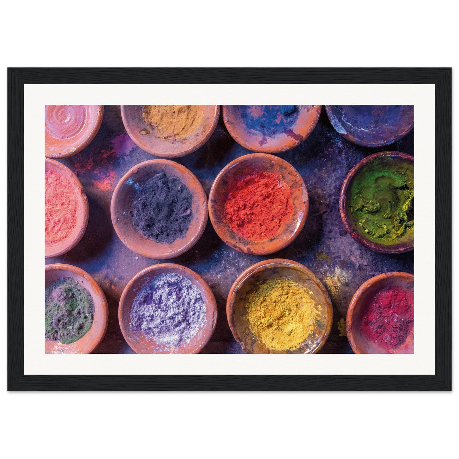 Wall print featuring assorted powdered colors for art or ceremony.

