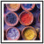 Bright and bold color arrangement in a series of small pottery bowls.

