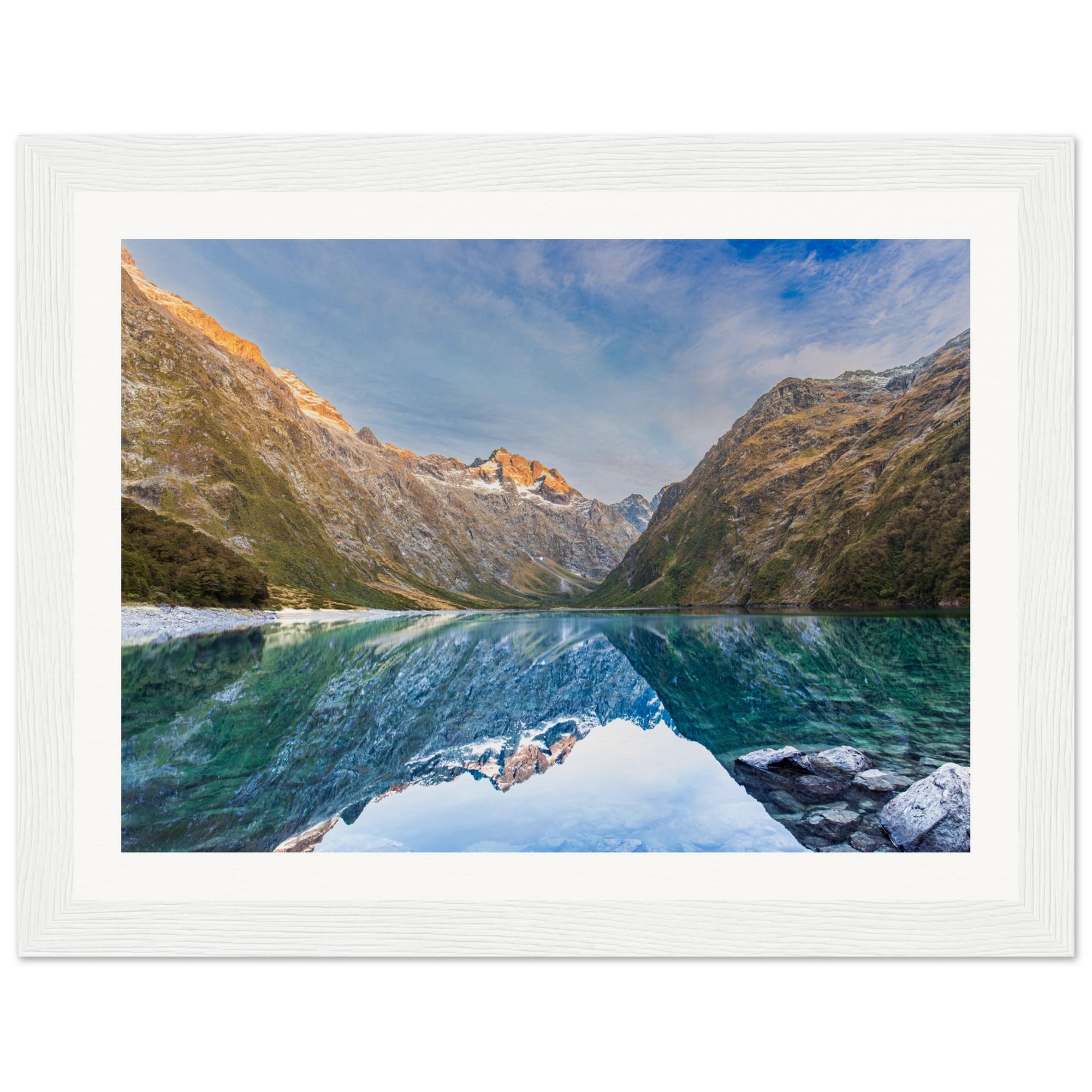 Blue dot marks ridge in framed scenic mountain portrait

