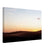 Sunset hike across the rolling dunes of a desert landscape.

