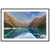 Portrait format of golden mountain ridge and still lake.

