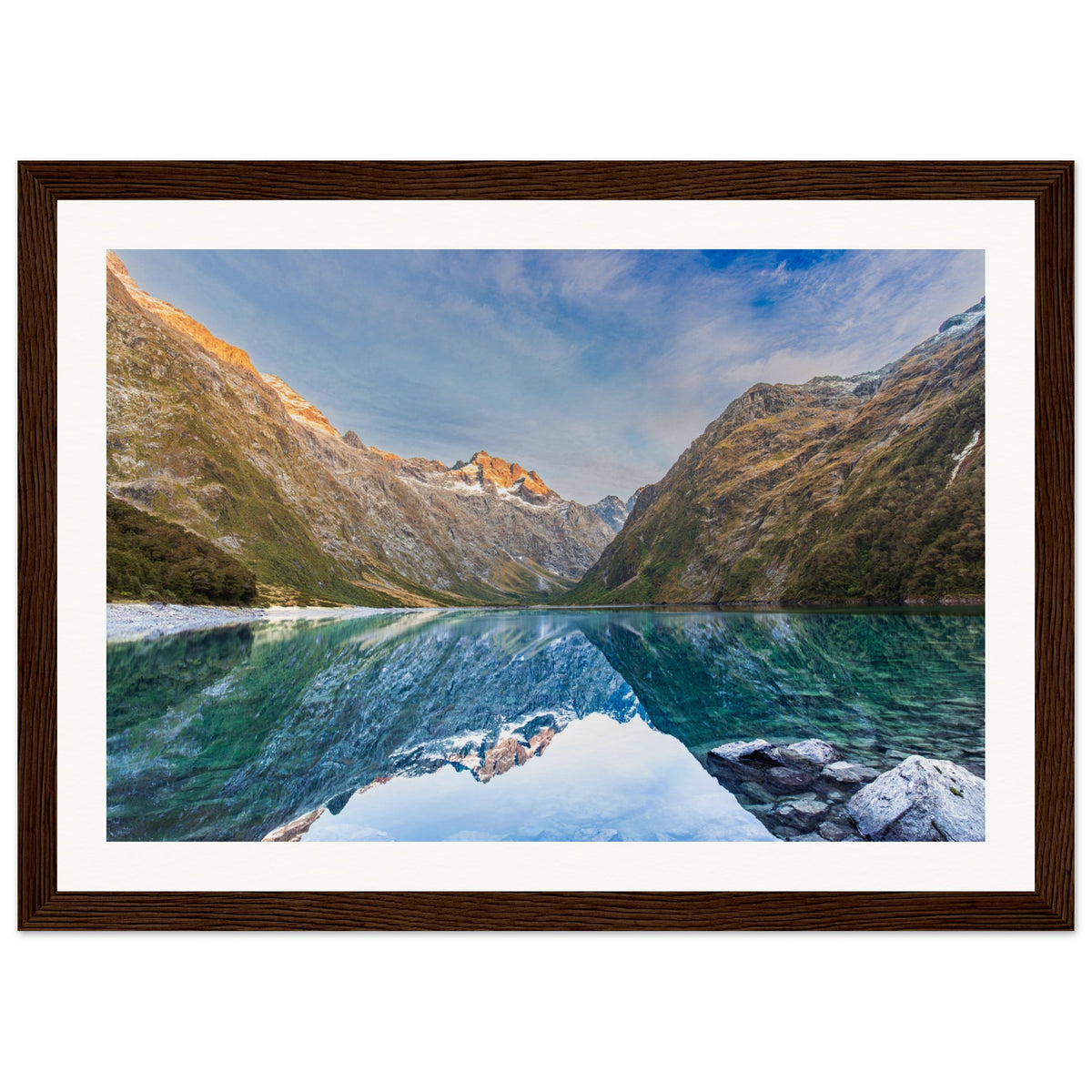 Framed vertical image of tranquil nature scene with ridge dot.

