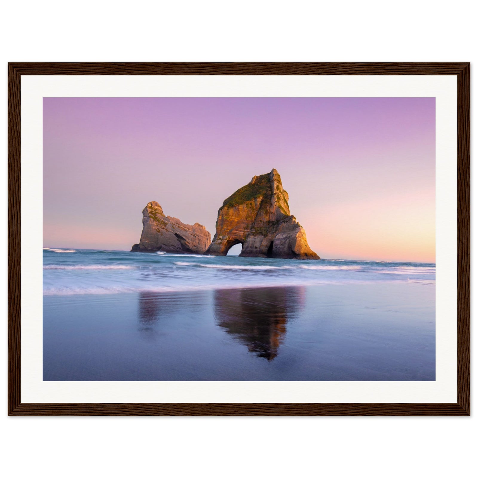 Ocean scenery with iconic arch rock in gentle light.

