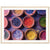 Collection of powdered dyes in terracotta bowls displayed in a frame.

