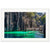 Framed coastal artwork of cliff shadows over glowing green water.

