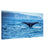 Marine wildlife scene featuring a whale tail in motion

