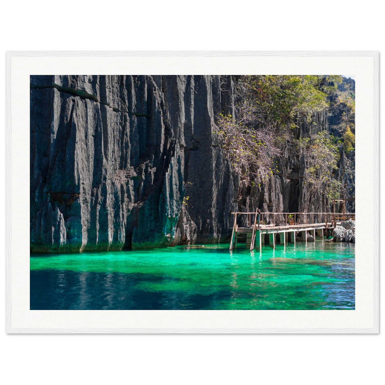 Framed island scene with tranquil waters and stony cliffs.

