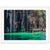 Clear green waters lap against vertical rocks in a framed nature photo.

