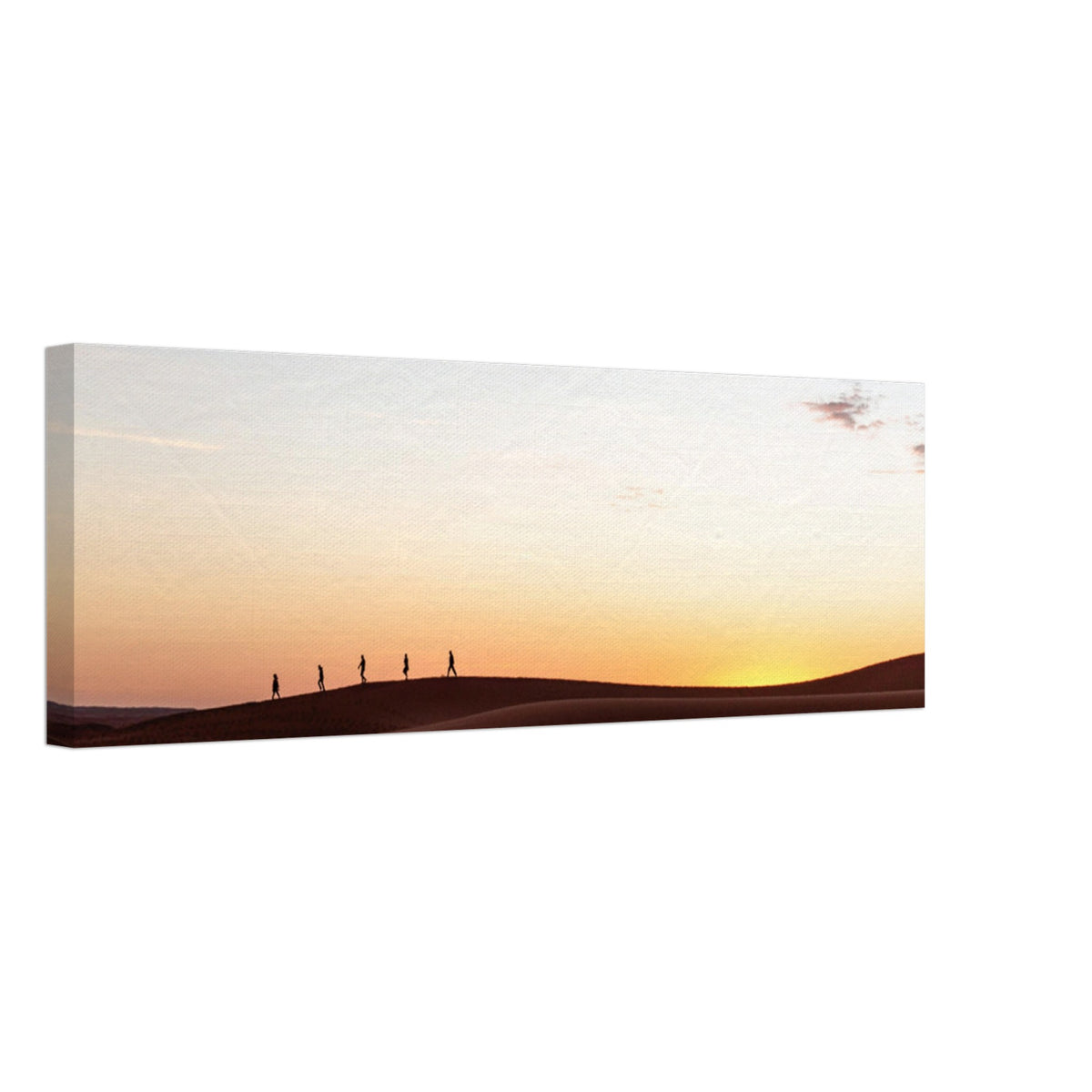 Walkers casting shadows on glowing sand dunes.


