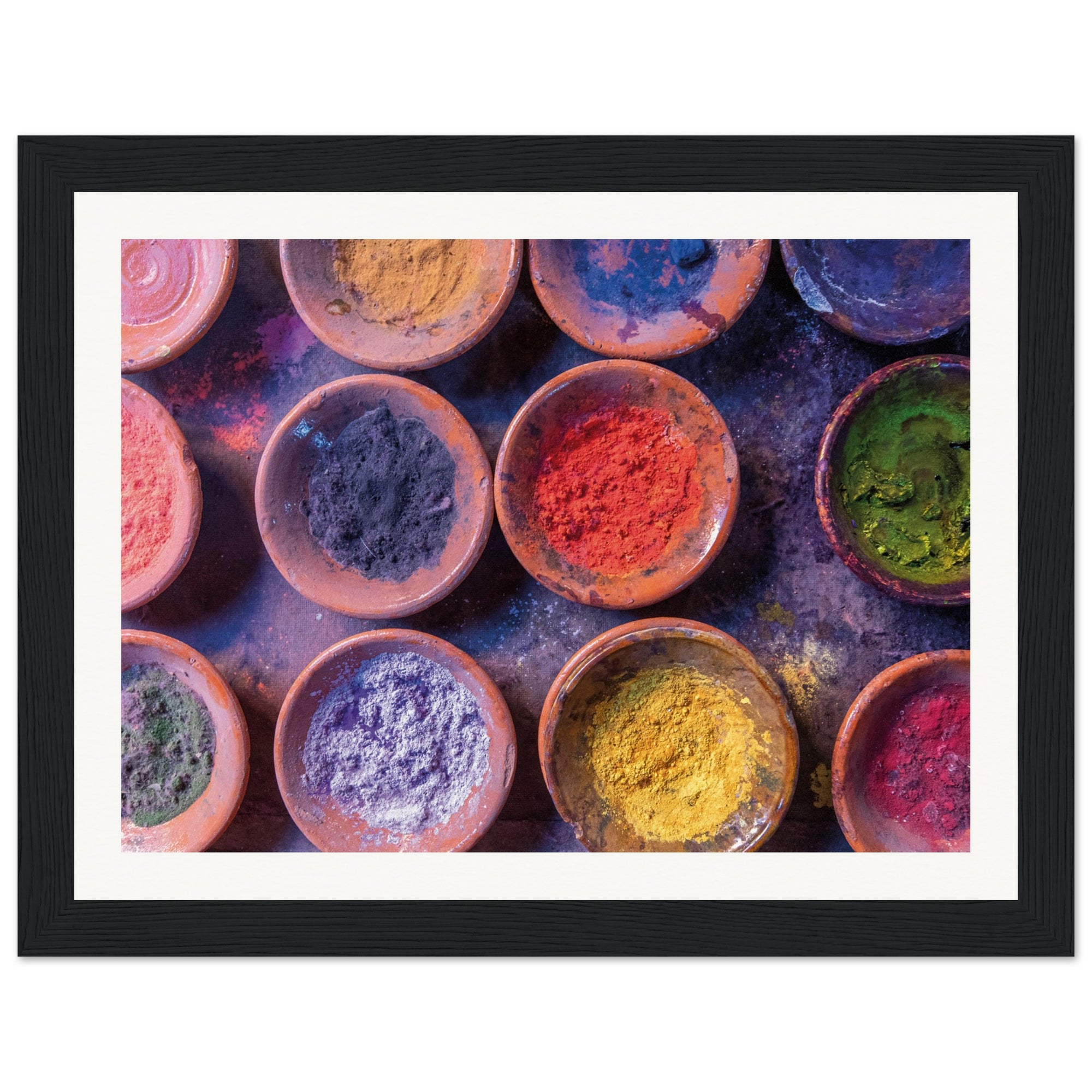Framed flat-lay of vibrant color bowls used for celebration.

