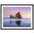 Portrait of tranquil beach waves and towering sea rock.

