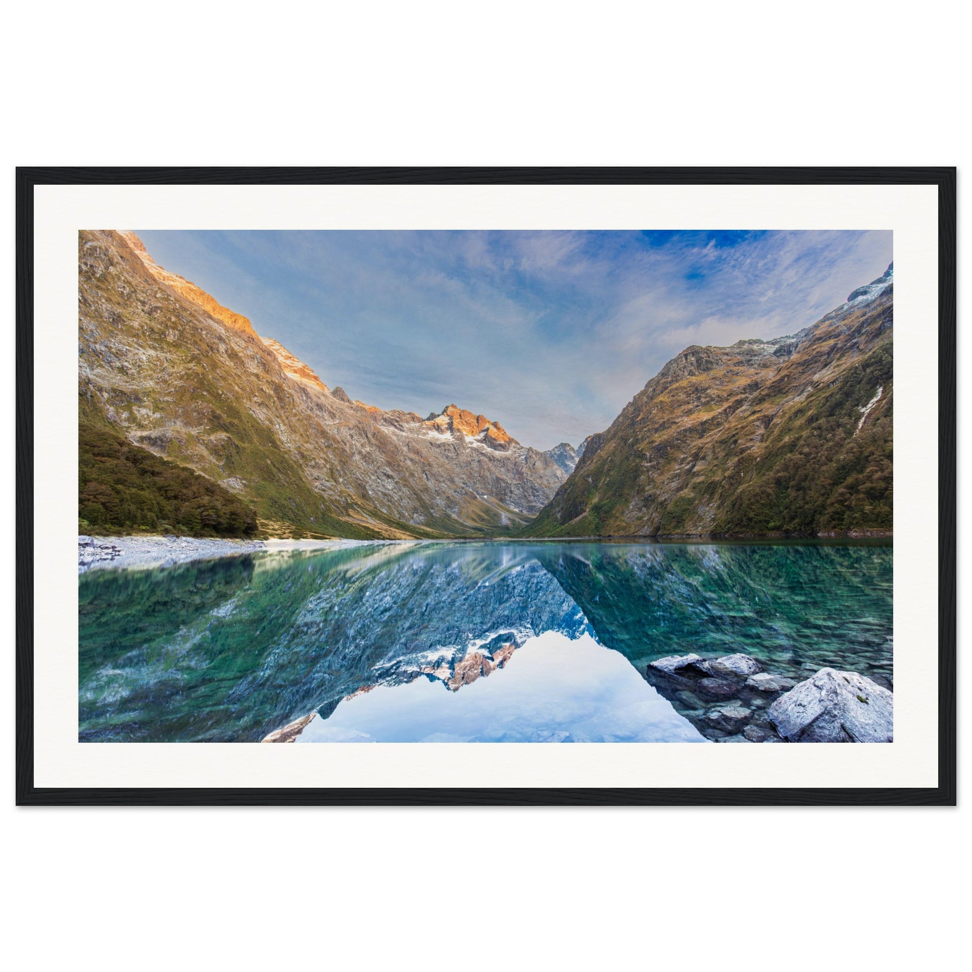 Vertical scenic image with clear reflections and blue dot accent.