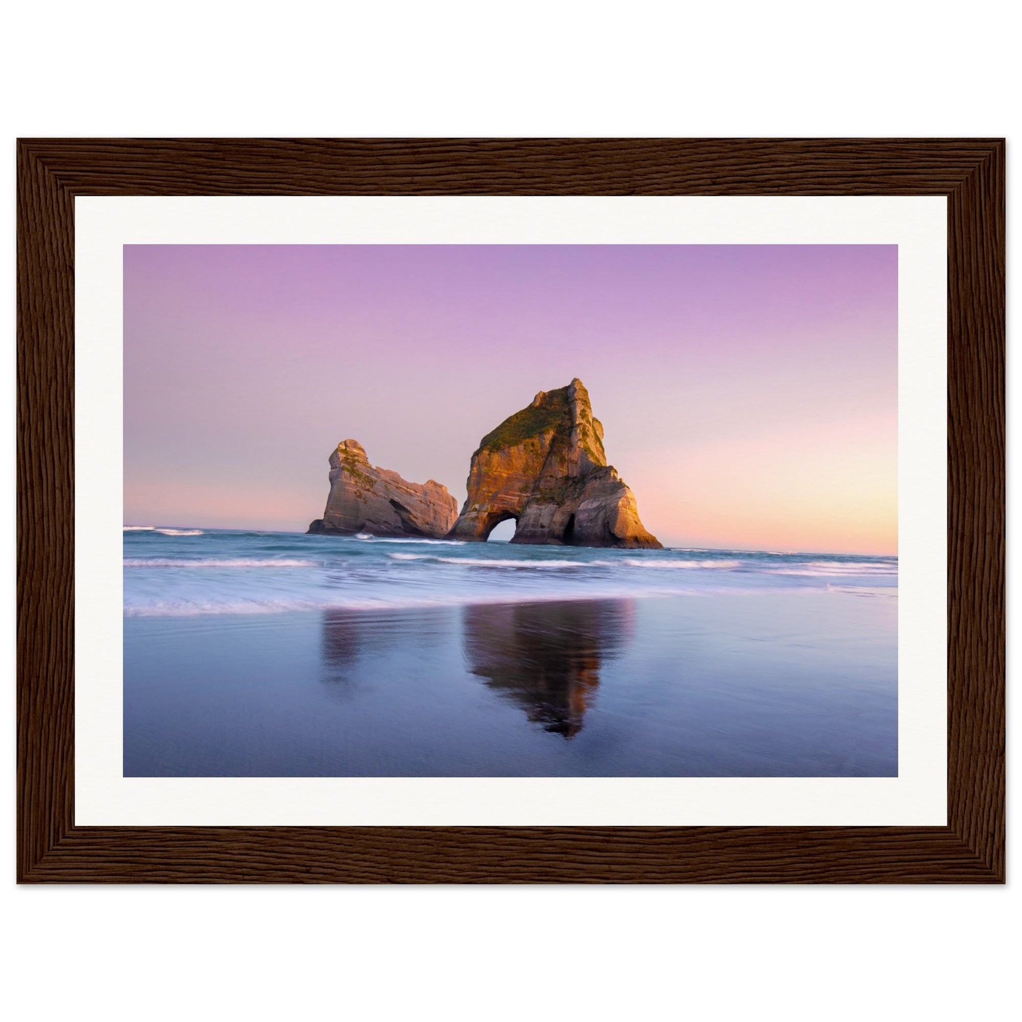 Serene seaside view with framed natural rock monument.

