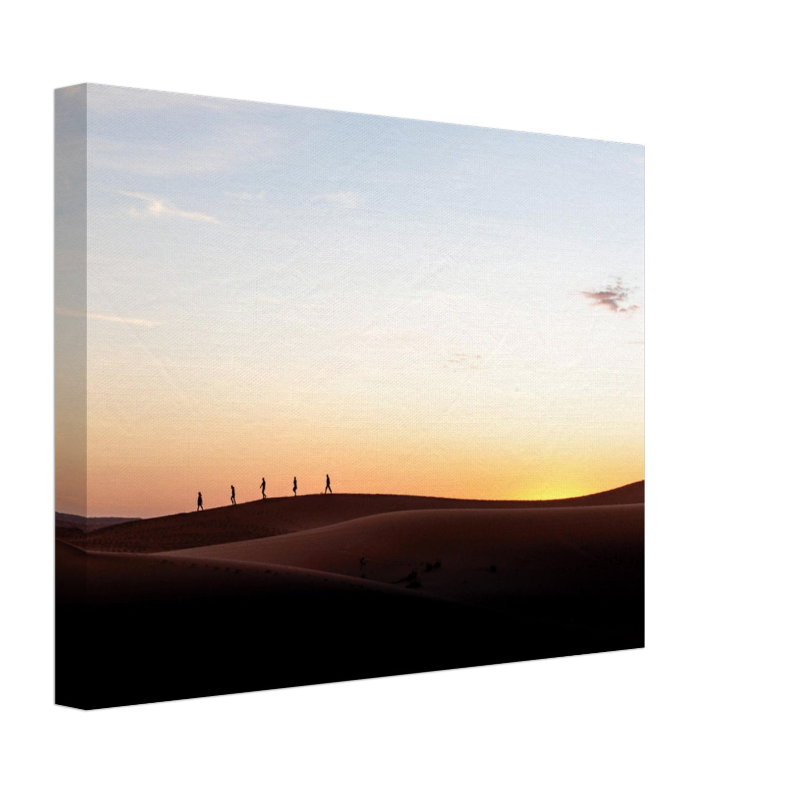 Evening silhouettes of travelers crossing wind-sculpted sand.

