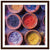 Decorative display of colorful powders arranged in a framed print.


