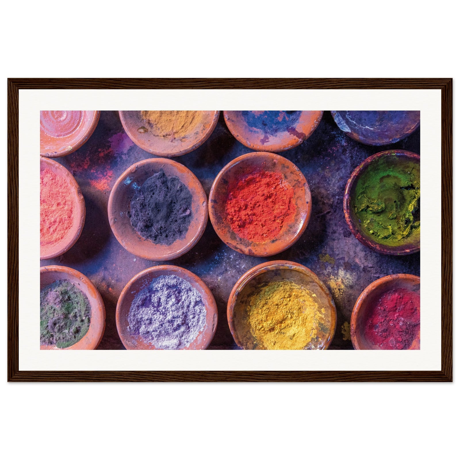 Framed visual of earthy bowls filled with vivid festival hues.

