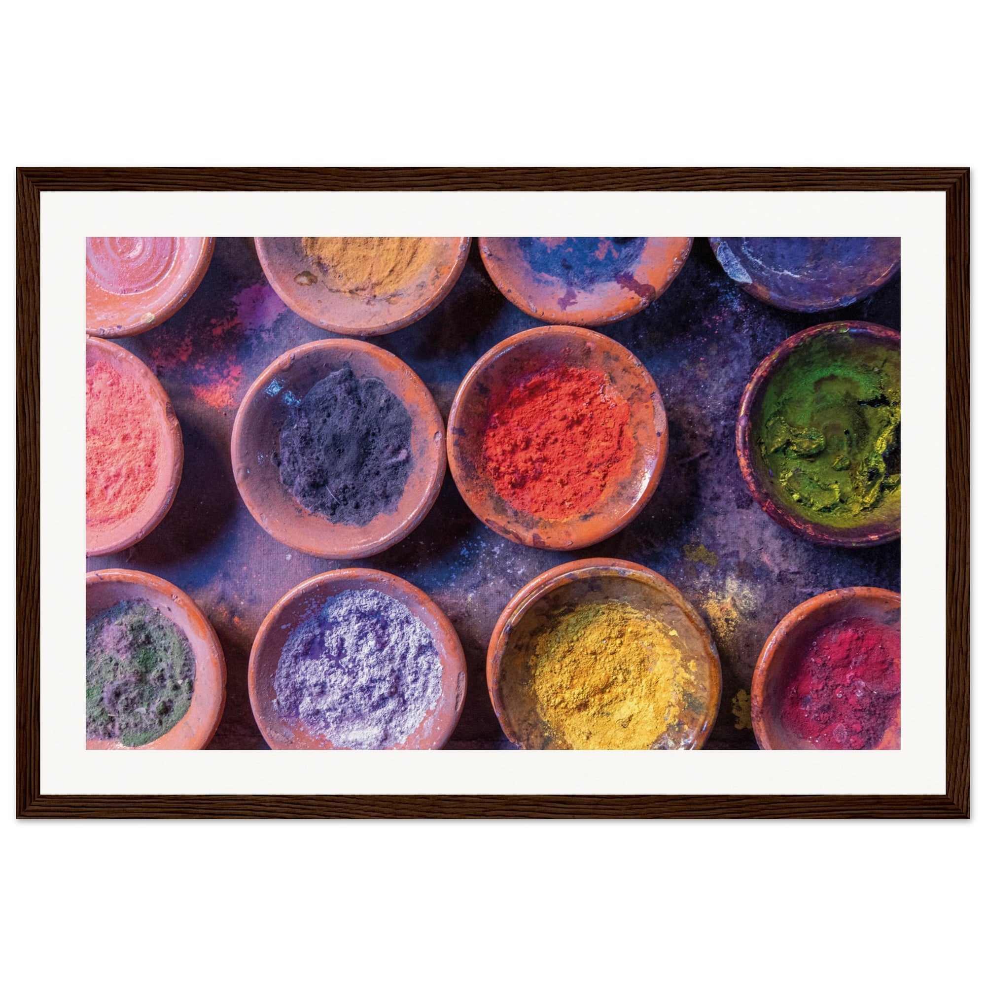 Framed visual of earthy bowls filled with vivid festival hues.

