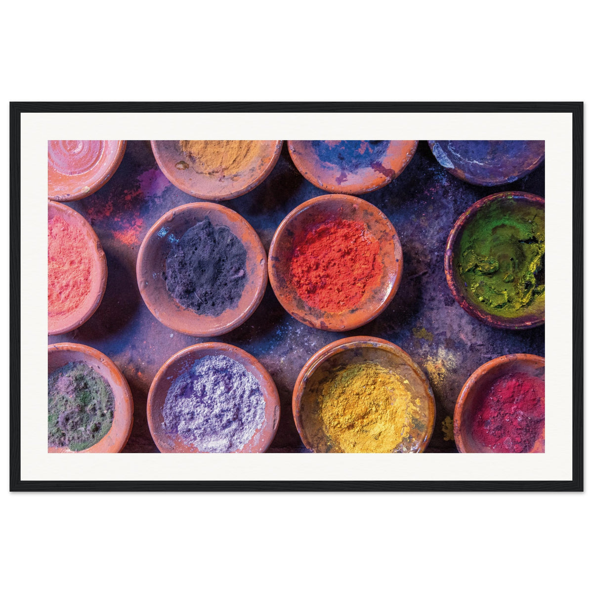 Top-down shot of artistic powders used in cultural traditions.

