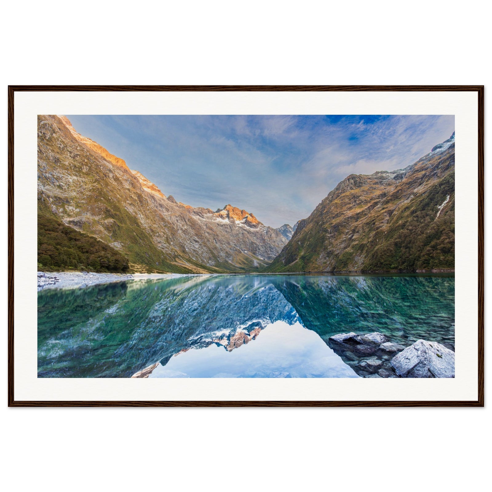 Portrait of mountains and lake, with a blue dot marking the ridge.


