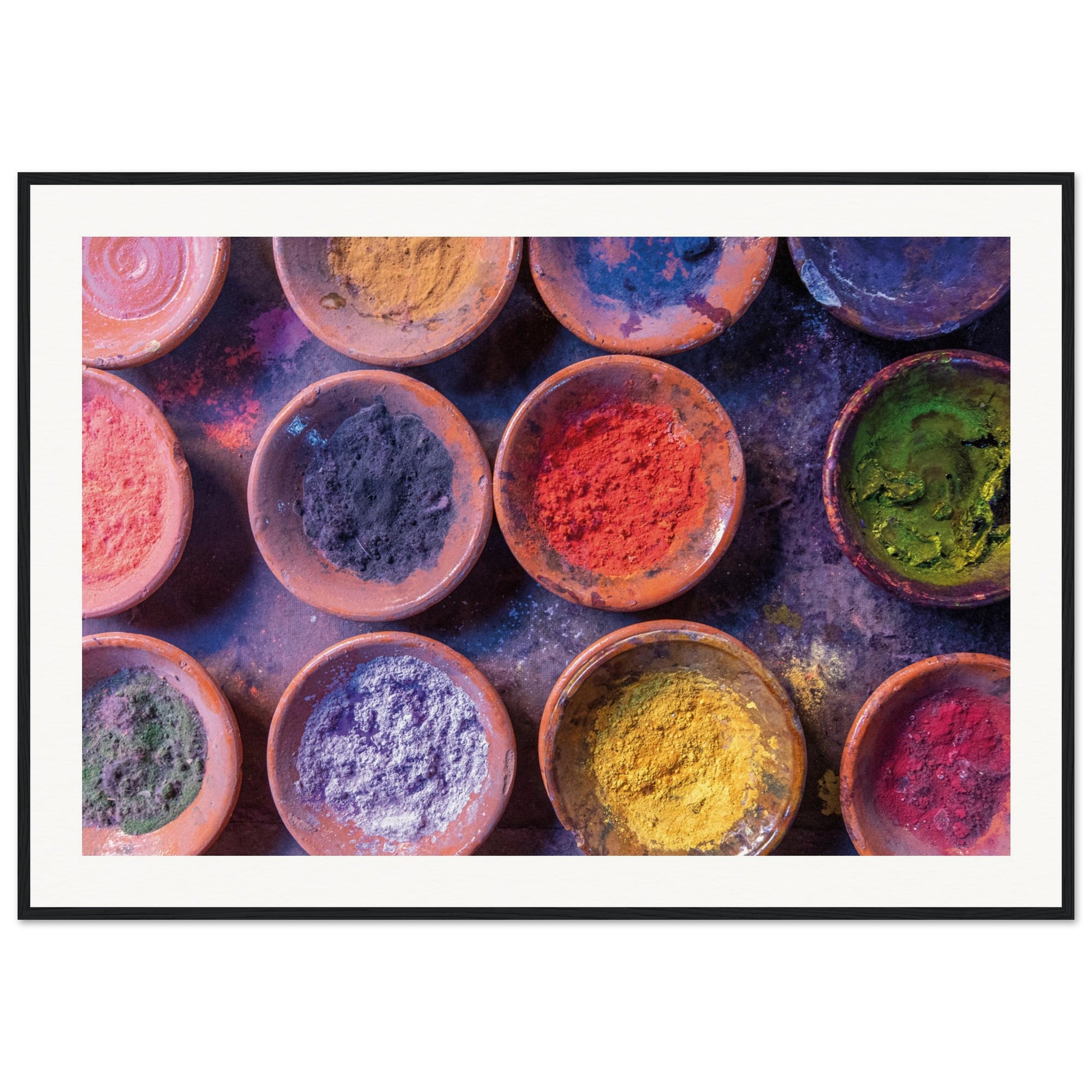 Framed cultural art featuring pigment powders in natural containers.

