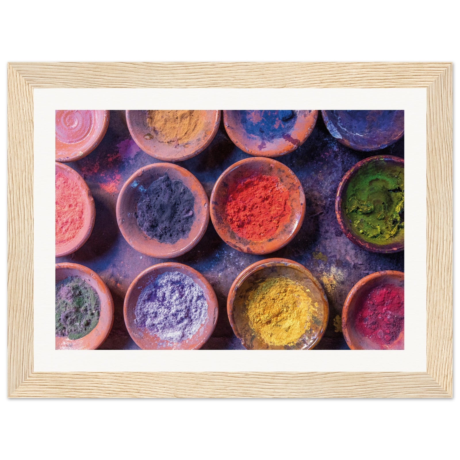 Earthy framed image of powdered dyes in symmetrical rows.

