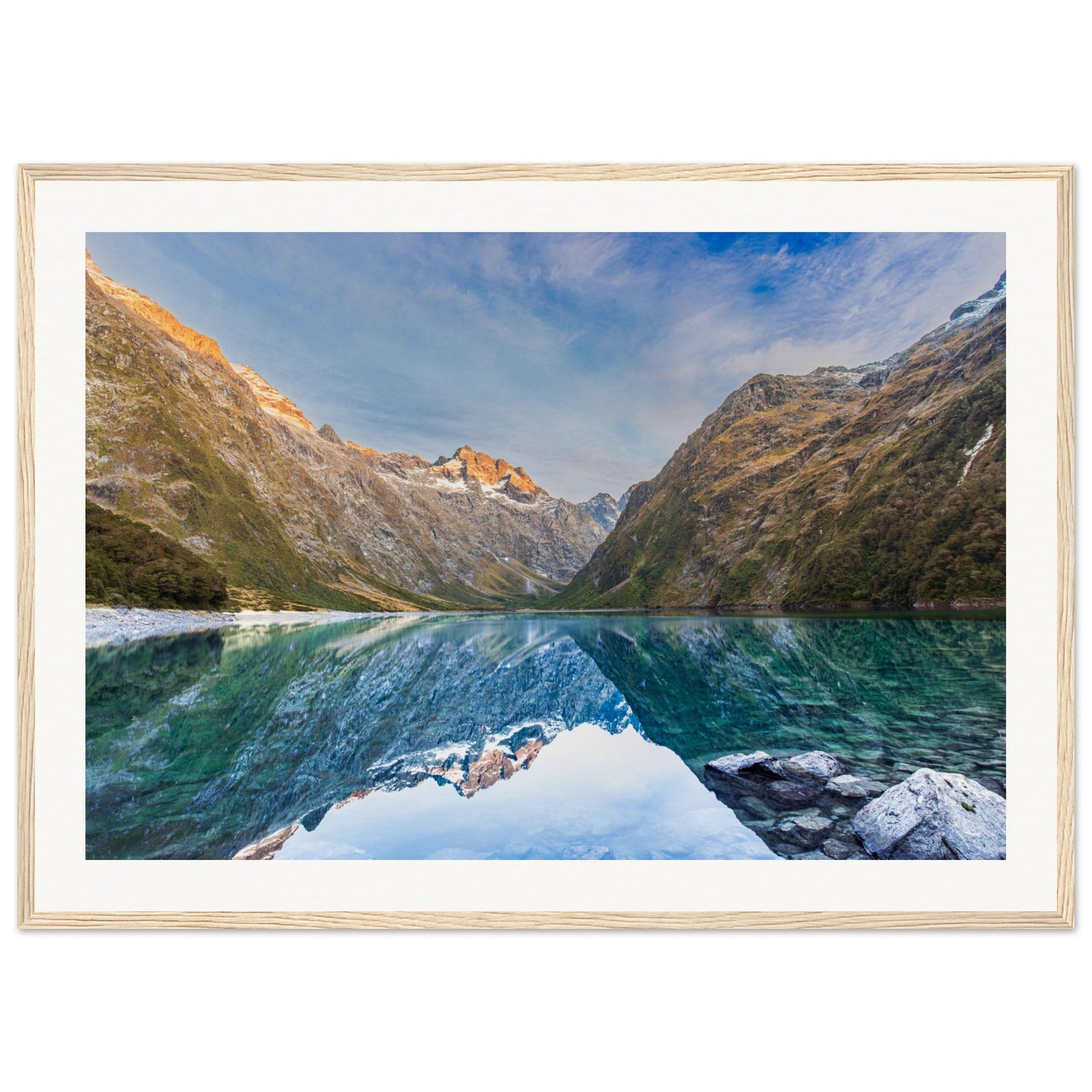 Framed scenic artwork showing serene alpine terrain and a blue highlight.

