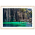 Framed landscape of teal lagoon bordered by towering rock walls.

