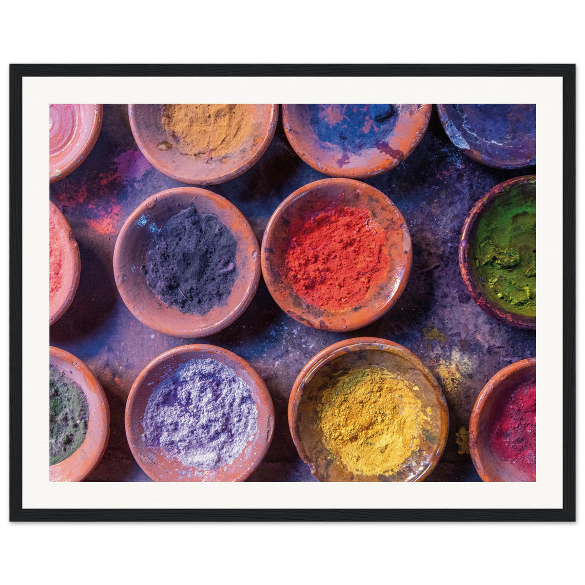 Natural color pigments in rustic round bowls on display.

