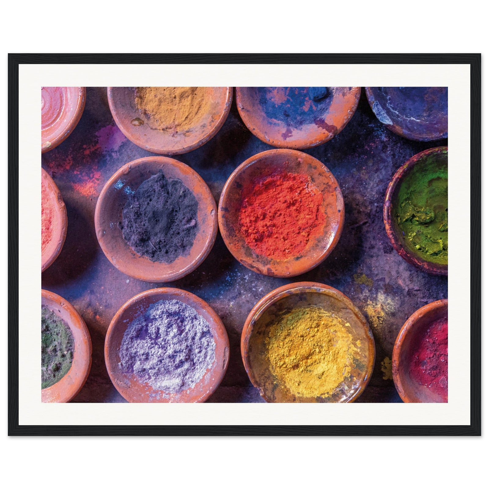 Natural color pigments in rustic round bowls on display.


