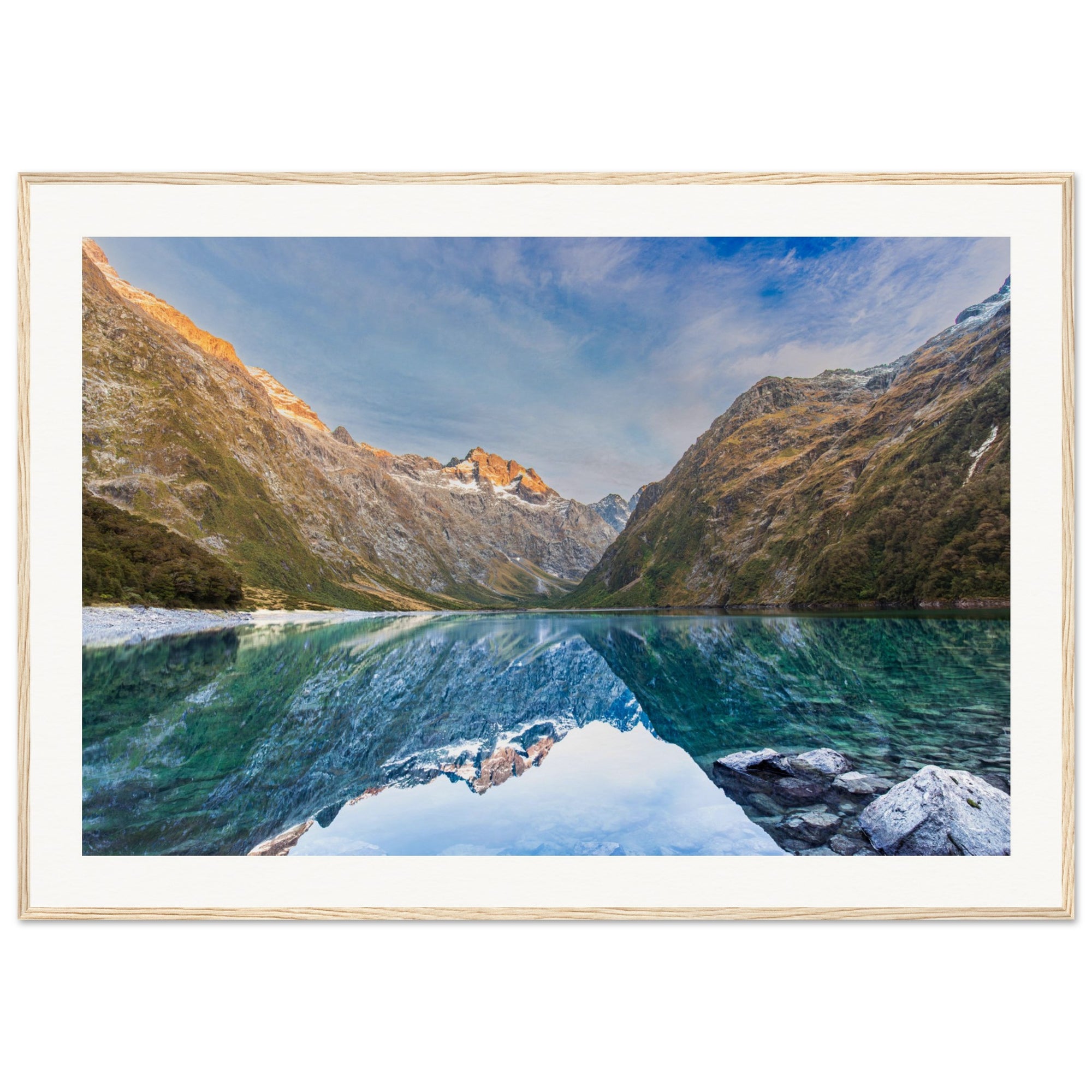 Vertical mountain view with lake reflection and blue dot highlight.

