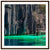 Tropical lagoon with jagged cliffs and a wooden dock in a portrait frame.

