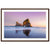 Minimalist ocean view with pink sky and rock in frame.

