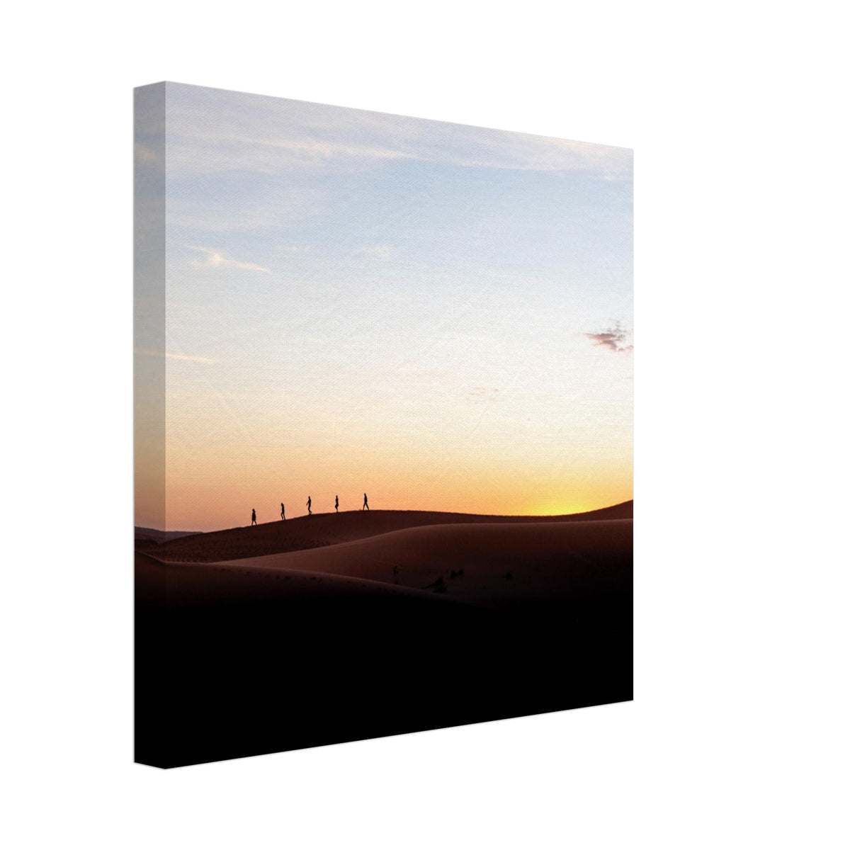 Small figures walking atop vast desert dunes at twilight.

