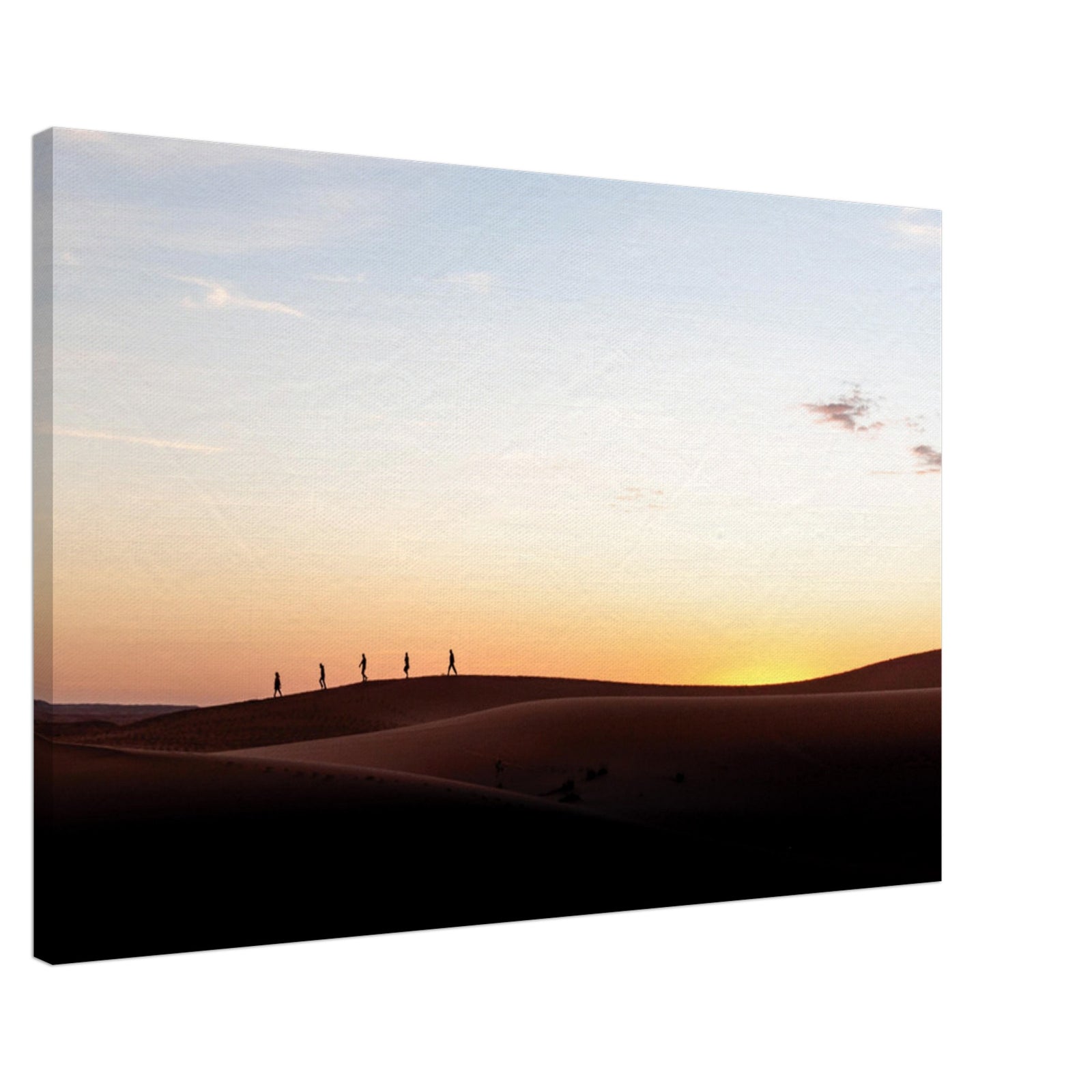 Horizon glow highlighting silhouettes on sand dunes.

