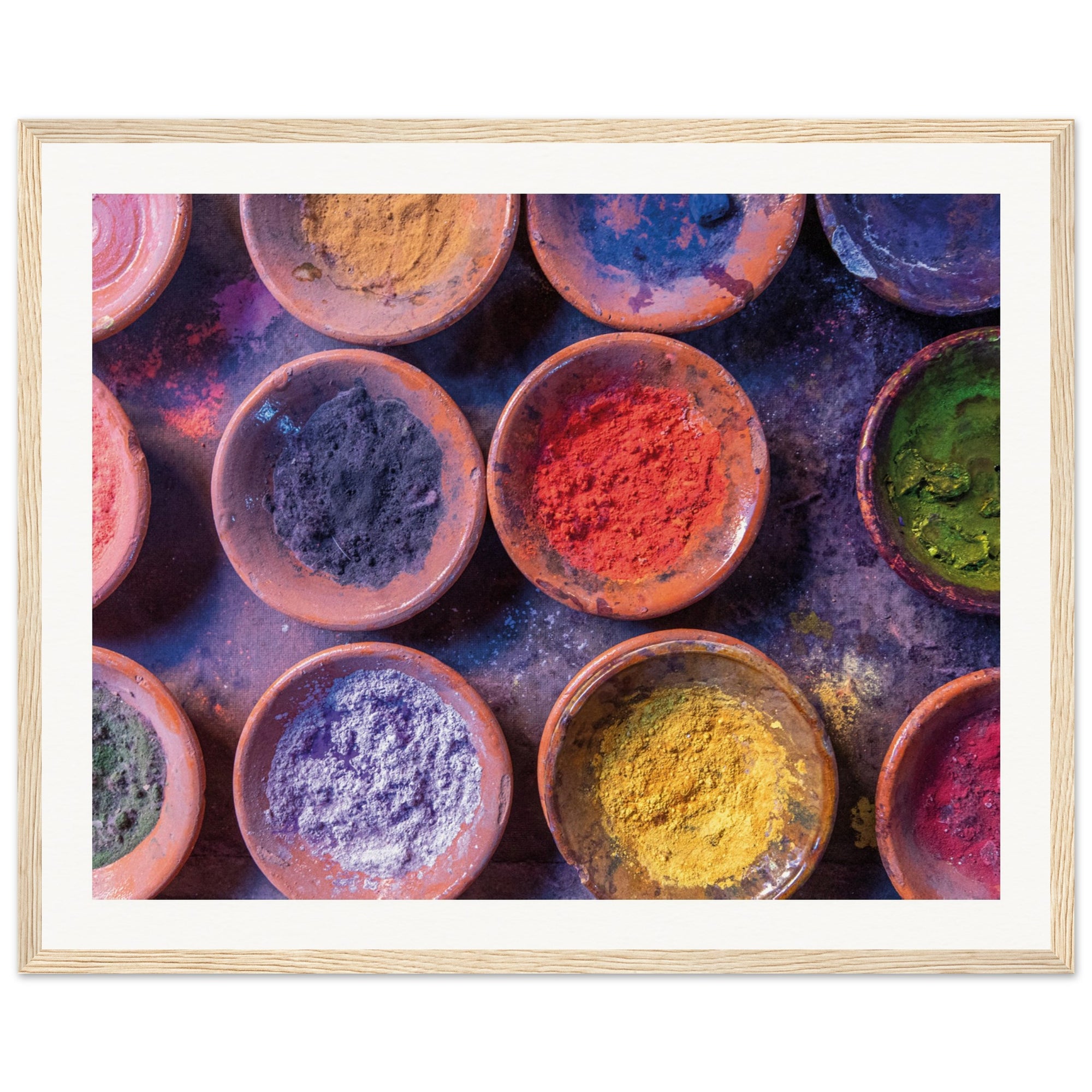 Wall art showing rich textures of powdered dyes in earthy bowls.

