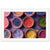 Bright color powders neatly organized in hand-crafted dishes.

