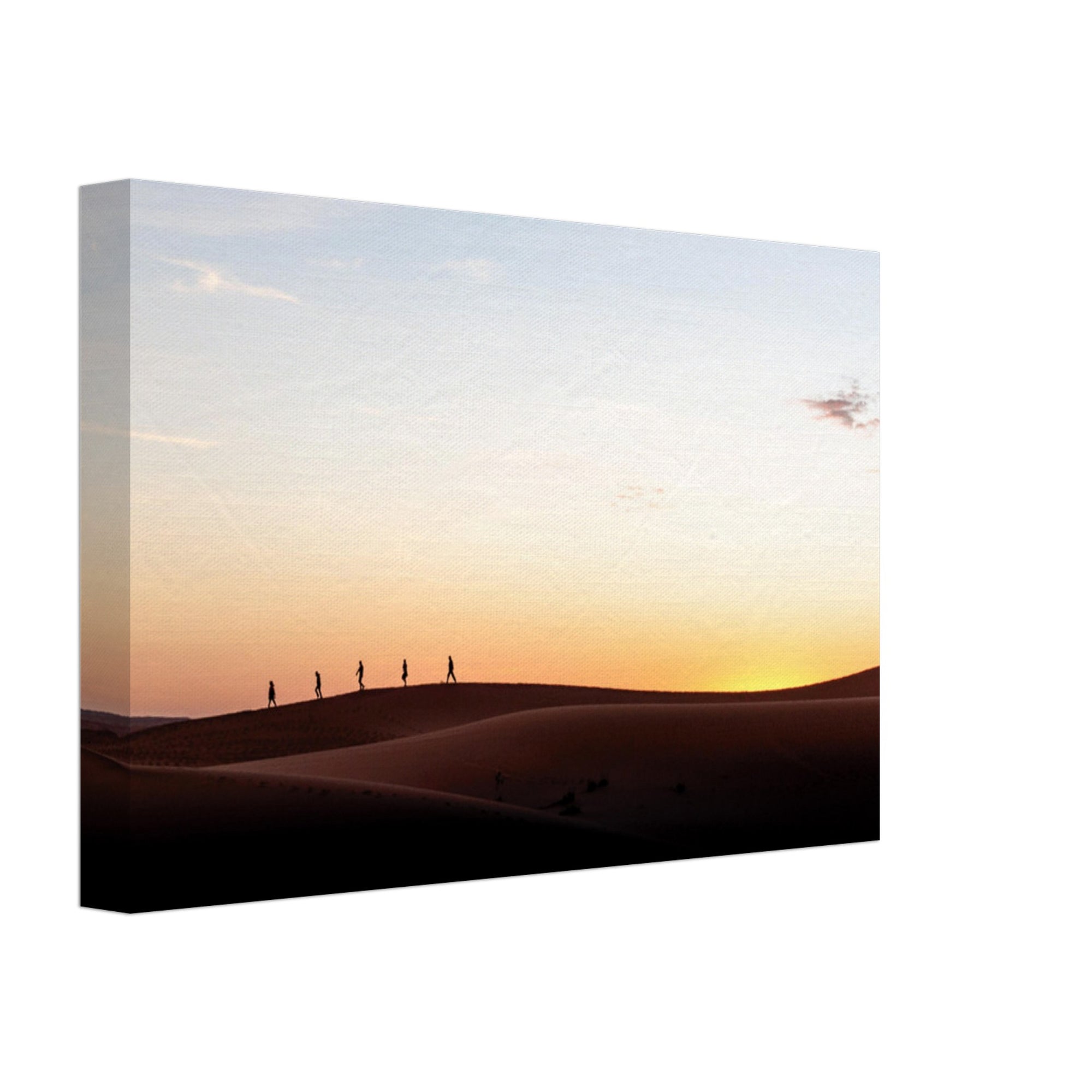 People trekking over sand dunes under a golden sky.

