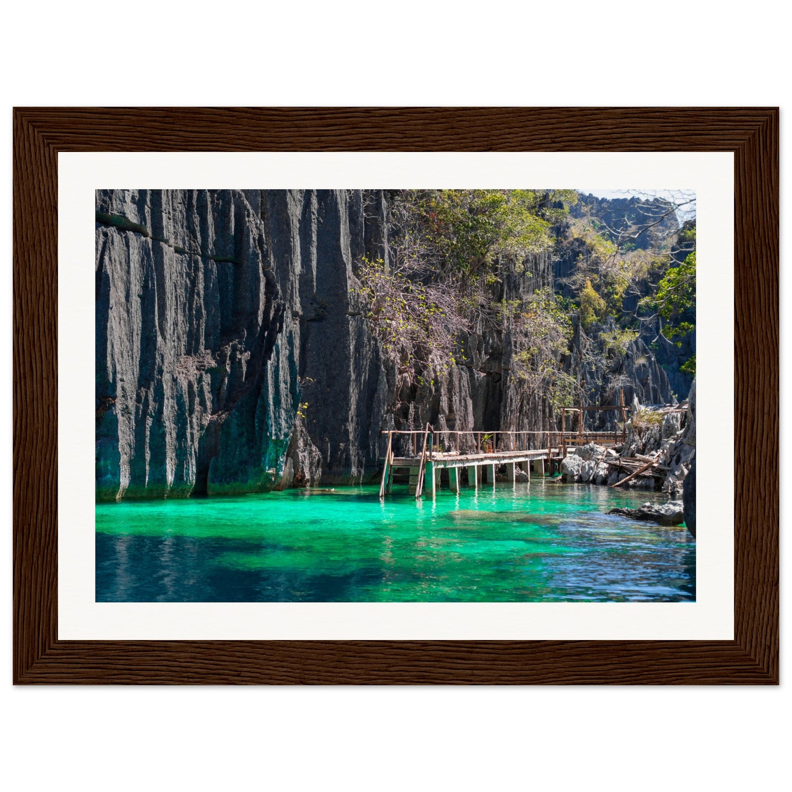 Vibrant green shallows beside towering cliffs in tropical wall art.


