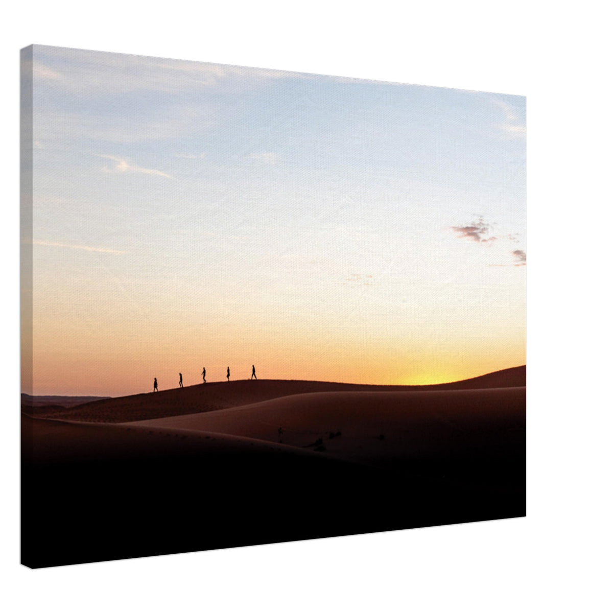 Lonely figures outlined by fading desert sunlight.

