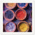 Colorful arrangement of ground pigments in hand-made pottery.

