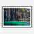 Framed photo of emerald water and limestone cliffs with a wooden walkway.

