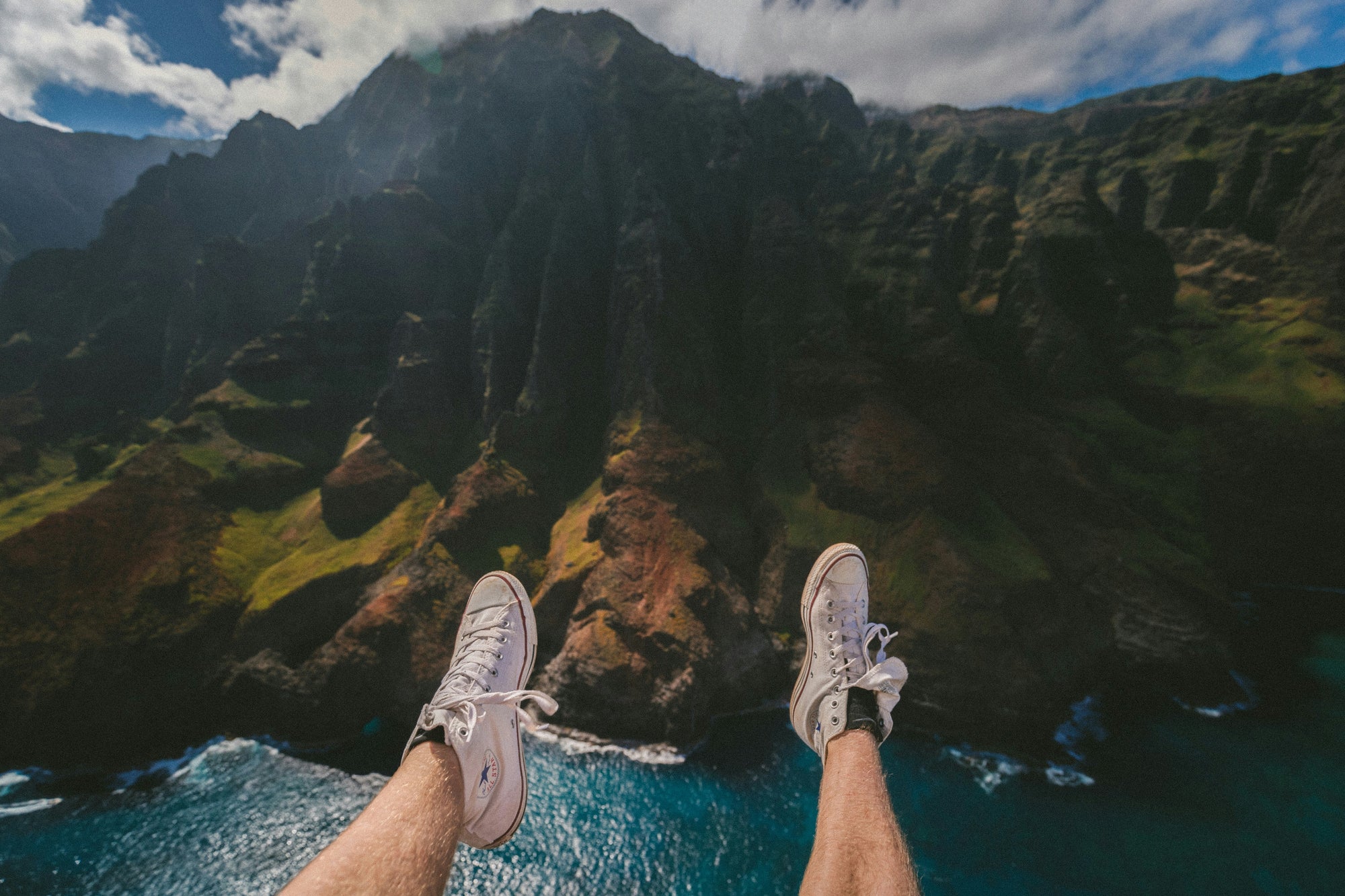 mountain legs over river